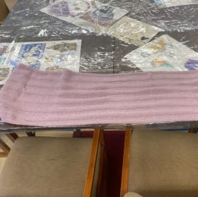 Bundle up in style with a red wrap cardigan and purple scarf item