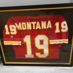 Autographed Joe Montana Jersey. Framed. item