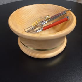 Handcrafted light wood turned nut bowl with tools and nuts item