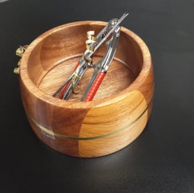 Handcrafted Variegated Bowl with Nuts and Nut Tools item