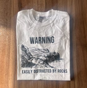 'WARNING Easily Distracted by Rocks' T-Shirt (Size L) item