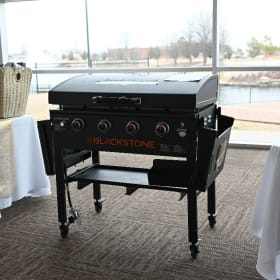 Item #15 36” 4- Burner Black Stone Grill with Hood & Omnivor item