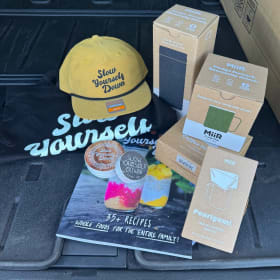 Slow Yourself Down Merch Tote full of goodies item