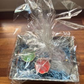 56. Candle and China Basket item