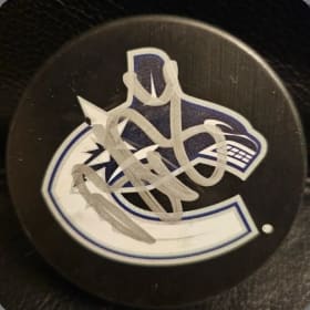 Signed Puck by Brock Boesser and Canucks Scarf item