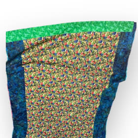“Rustling Leaves appliquéd in colorful Batiks” Throw Quilt item