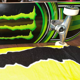 Monster Energy skateboard and Towel item
