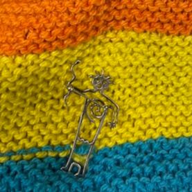 4. Hand-Knitted Shrug + Pin item