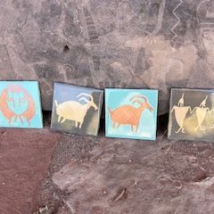 Black, orange, and blue handcrafted ceramic tiles item