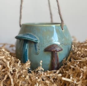 15. Handcrafted Ceramic Hanging Planter item