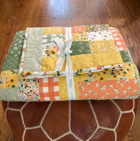 Handmade Quilt, 60" x 70" and includes small baby blanket item