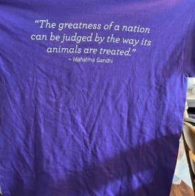 Purina/Ghandi Quote Tshirt Purple item
