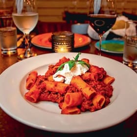 Laugh & Dine – Comedy Night for 10 + $50 Victoria’s Tratta item