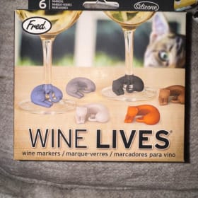 Cuddly cats claim your wine. item