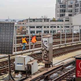 MTA workers walking the tracks item