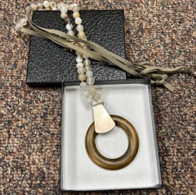 31. Handcrafted Wooden Necklace – Valued at $50 item