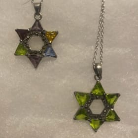Pair of cut stone Jewish star pendants item