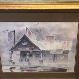 Framed Tom Bond Print. Frame has a scrape - needs touch up item