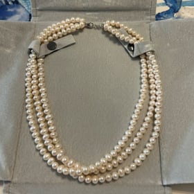 Three strand pearl necklace item