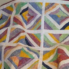49. Mosaic Magic – Window Pane Bubble Quilt – Value: $90 item