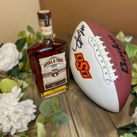 Own a Piece of Cowboy History: Autographed Football/Bourbon item