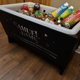 Cooler fire pit with nips item