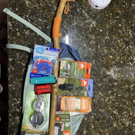 Basket # 22  Locally Carved Walking Stick & Day Pack item