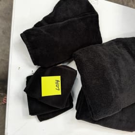 A107- black towels, (2)hand towels and (3) washcloths item