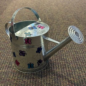 Ms. Breuier's watering can item