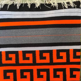 Hand Woven Artisan Rug - Orange, Black, & Gray item