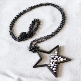 Black Star Pendant Necklace with Gemstone Accents item