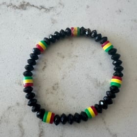 Handcrafted Striped Bead Bracelet with Vibrant Color Accents item