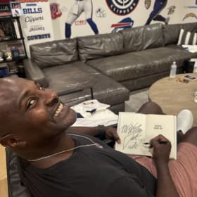 Autographed Chargers jersey in a frame and item