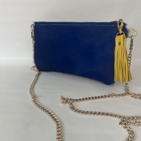 Cowhide Clutch donated by: Shop Taylor Gray item