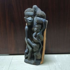 Hand-Carved Wooden Family Sculpture with Natural Bark Detail item