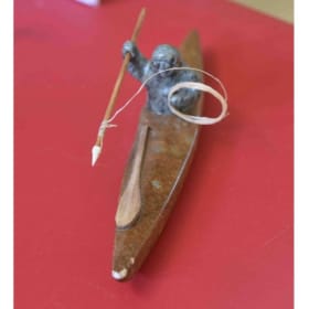 Carved Inuit hunter in kayak item