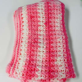 Handmade Pink and White Crocheted Blanket item