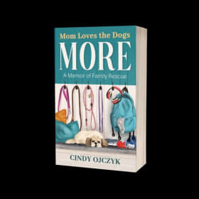 "Mom Loves the Dogs More" book by Cindy Ojczyk, value $17 item