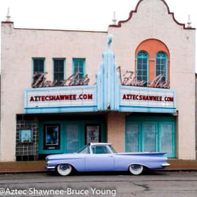 4 tickets to Aztec theater & $20 to The Flying Cow & mug item