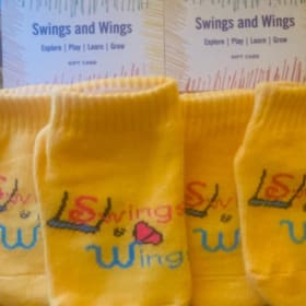 Swings and Wings: 2 'Free Play' Gift Cards with Socks item
