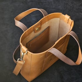 Brown tote with burned dogwoods item