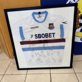 Signed and framed West Ham Utd top item