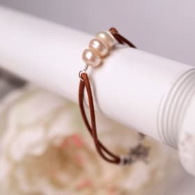 3 pearl Tan bracelets item