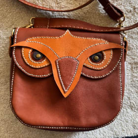 Brown leather purse with owl face item