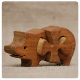 Hand-Carved Three-Piece Pig Puzzle item