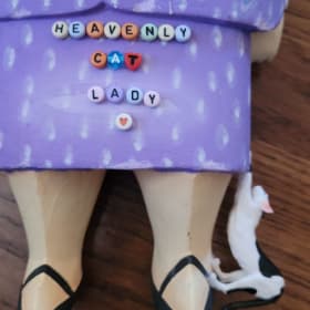 "Heavenly Cat Lady" carved statue item