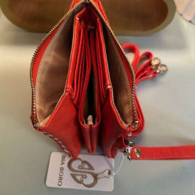 red/orange x-body bag/wallet item