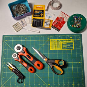 Pins, needles, mat, cutters item