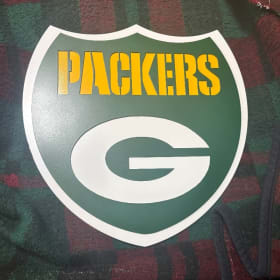 Item #19: First of two Green Bay Packers Shields item