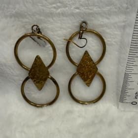 Figure 8 brass earring (item 19) item